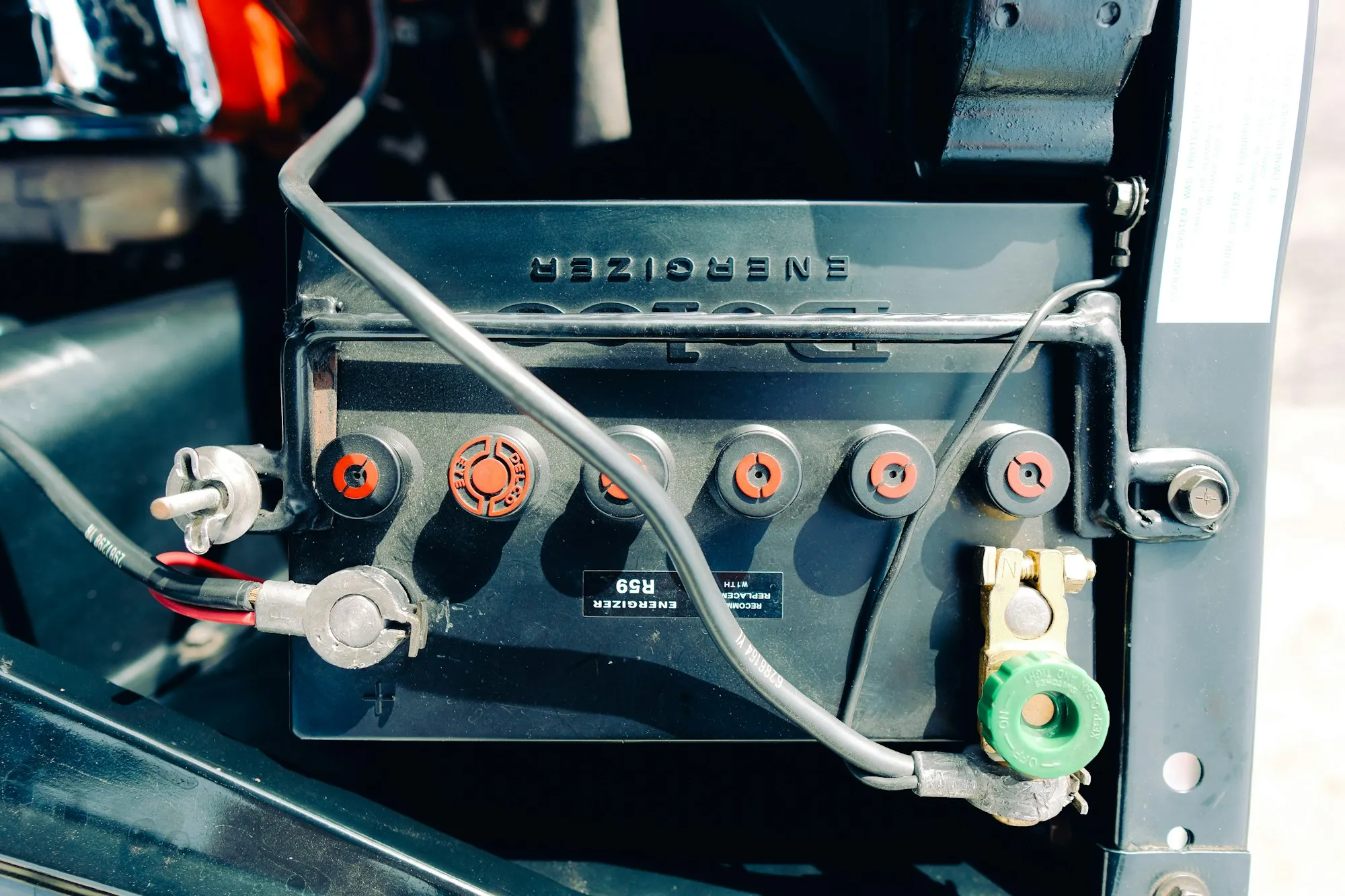 Close-up of a lead-acid battery with cables attached